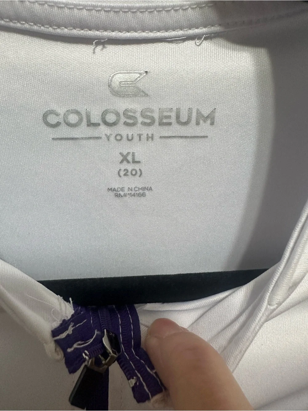 Two K-State Colosseum Youth XL quarter zips.